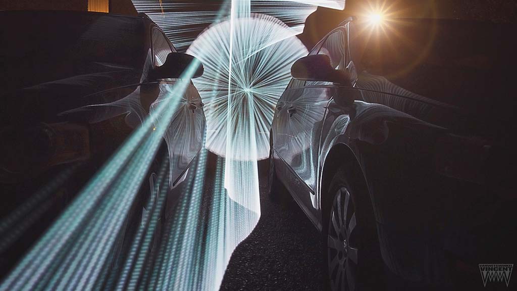 Vincent Vanwetswinkel brings us this rather unique shot with cars, ribbons, spins, and reflections.